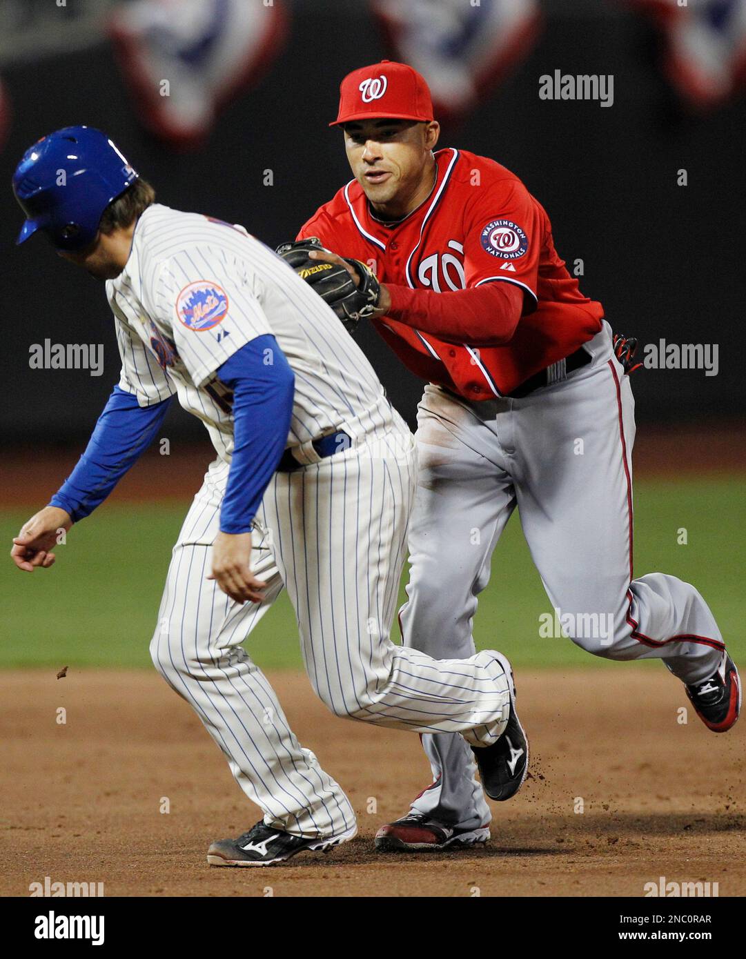 Washington Nationals' Ian Desmond, right, tags out New York Mets' Mike  Nickeas during the sixth inning of a baseball game on Saturday, April 9,  2011, at CitiField in New York. (AP Photo/Frank