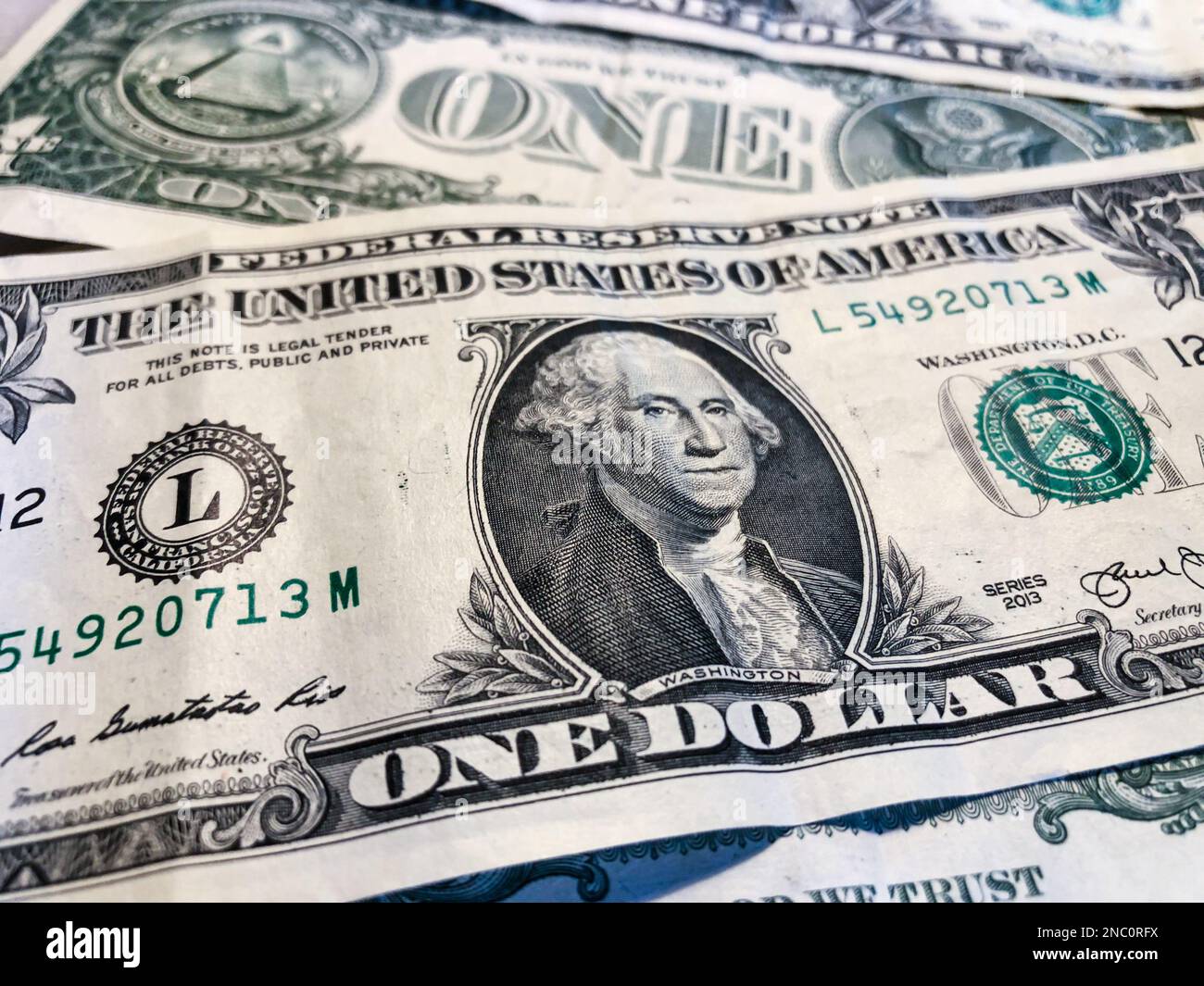 US dollar bills. One dollar. American money. Concept about the value of US dollars and inflation. Cash Dollar. US dollars background Stock Photo
