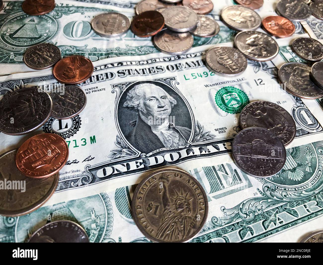 US dollar bills and coins. American money. Concept about the value of
