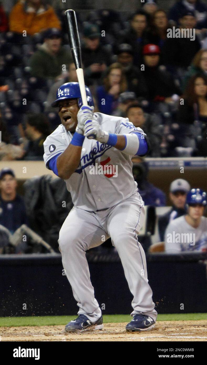 Los Angeles Dodgers' Juan Uribe reacts to striking out with a runner on  third and no one out in the second inning against the San Diego Padres in a  baseball game in