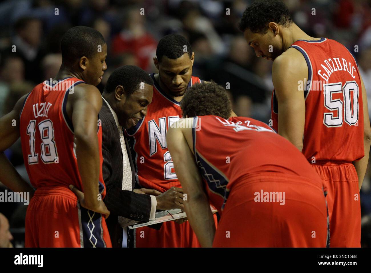New Jersey Nets head coach Avery Johnson gives instructions to players