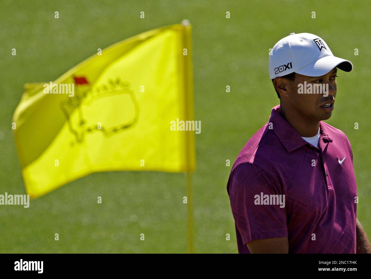 Tiger Woods putts on the 18th hole during a practice round for the