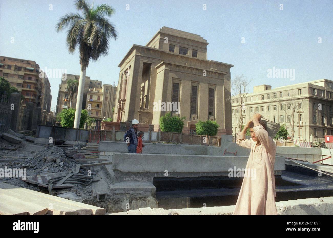 Workers in downtown Cairo on June 19, 1987 finishing up construction ...