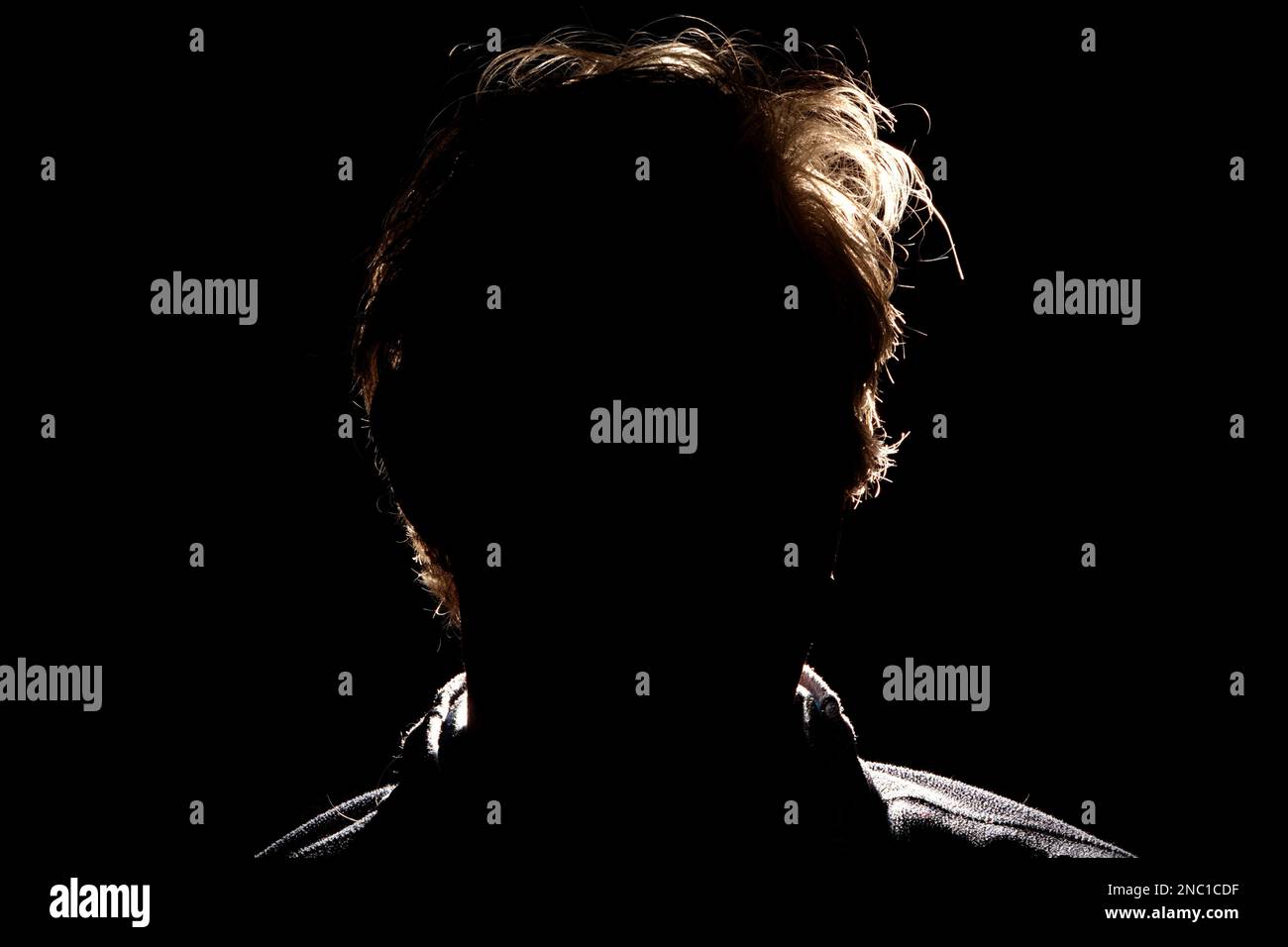 Guess who? - A black and backlight portrait Stock Photo