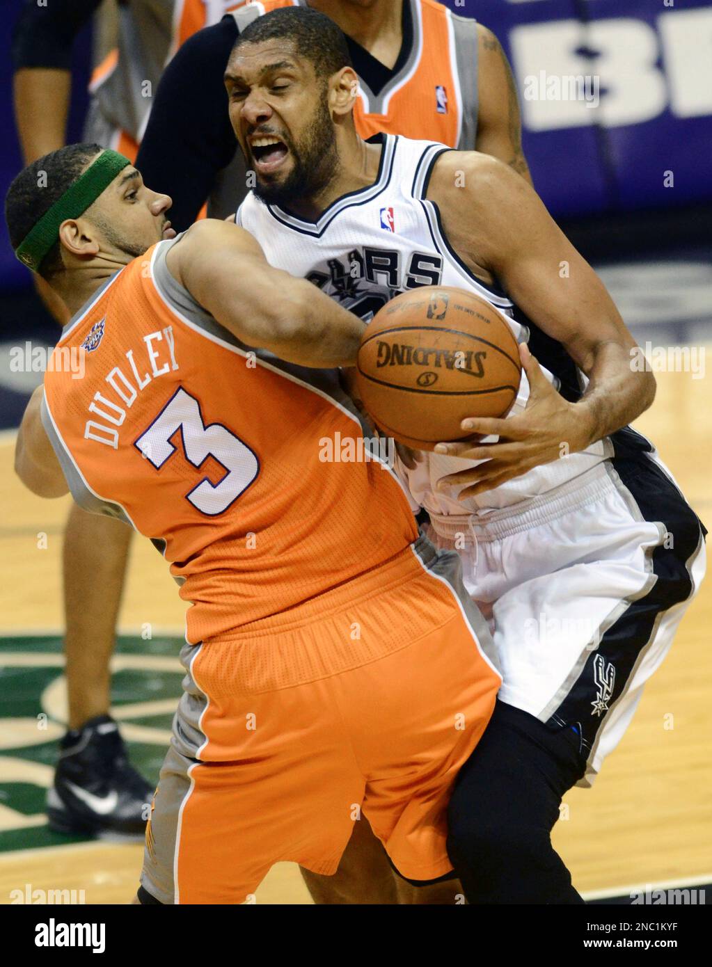 San Antonio Spurs forward Tim Duncan, right, loses the ball as he is defended by Phoenix Suns forward Jared Dudley (3) during the first half of an NBA basketball game at the AT&T Center in San Antonio, Sunday, April 3, 2011. (AP Photo/Bahram Mark Sobhani) Stock Photo