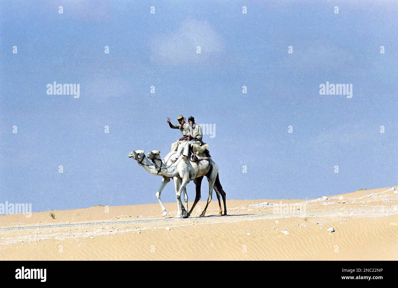 Two Egyptian soldiers, members of the Egyptian border patrol, ride ...