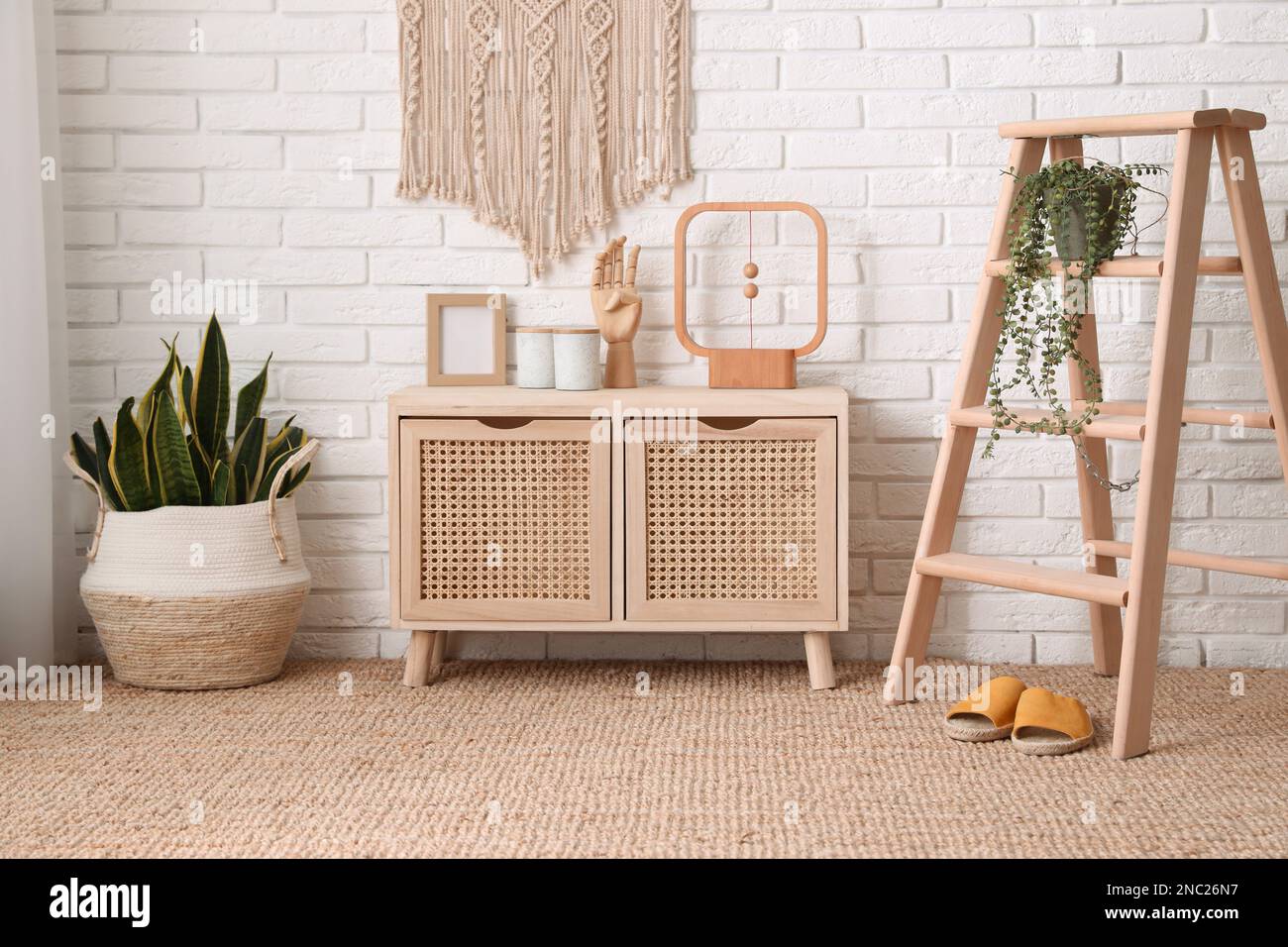 Modern room with wooden commode. Interior design Stock Photo - Alamy