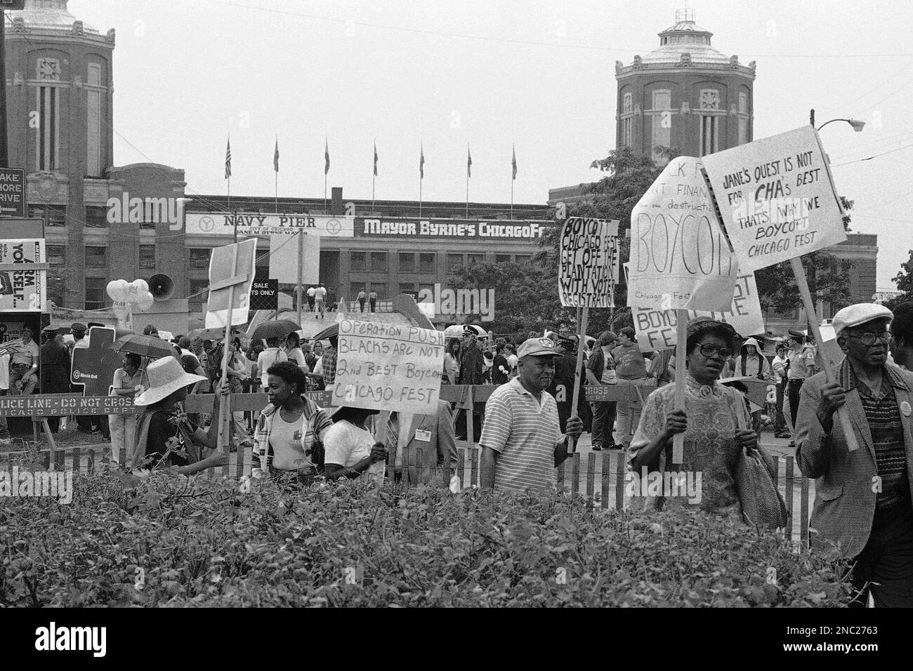 Walking holding placard western script protest Black and White Stock ...
