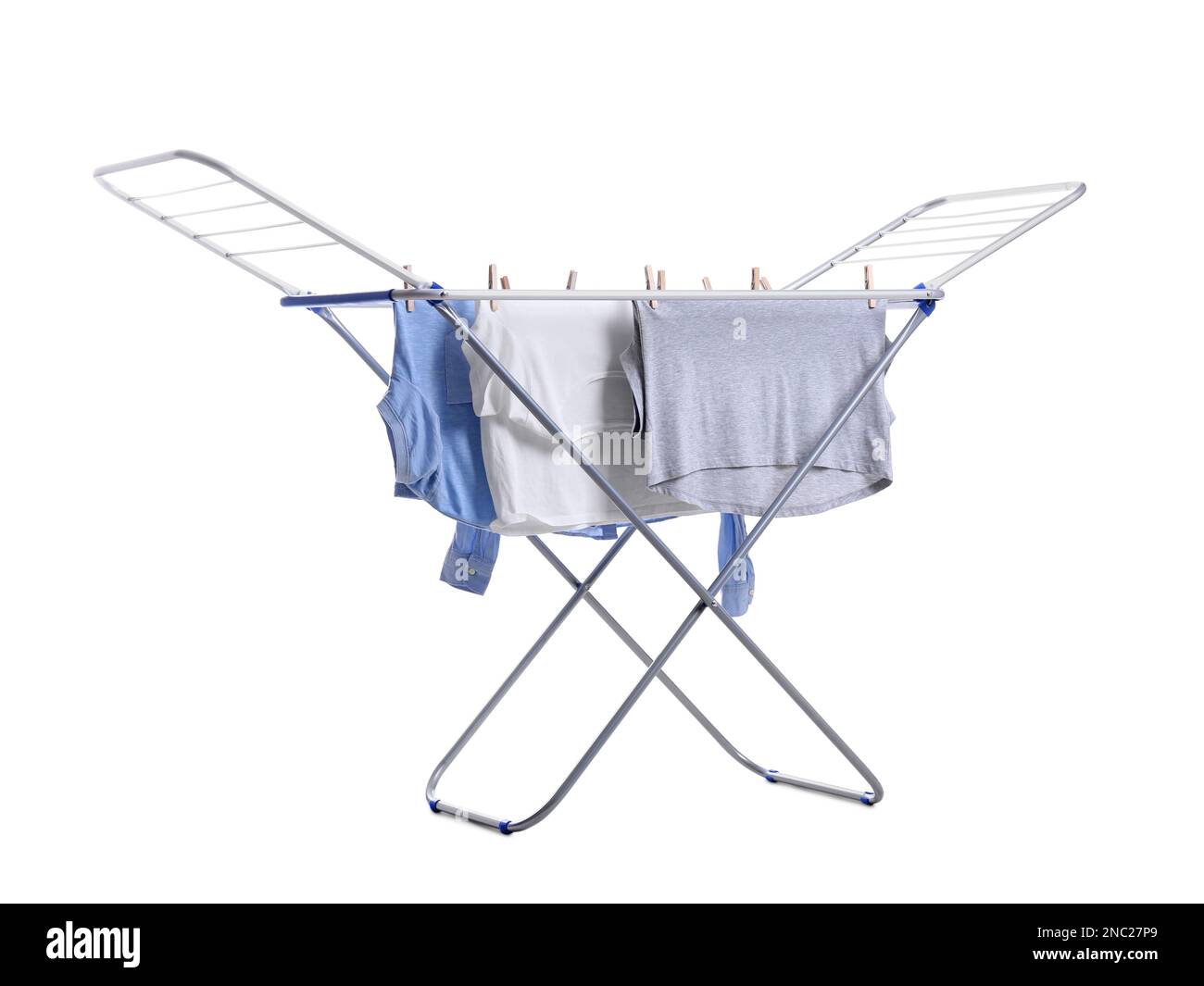 Clean laundry hanging on drying rack against white background Stock