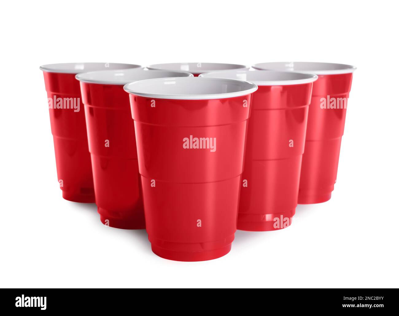 Many red plastic cups on white background. Beer pong game Stock Photo