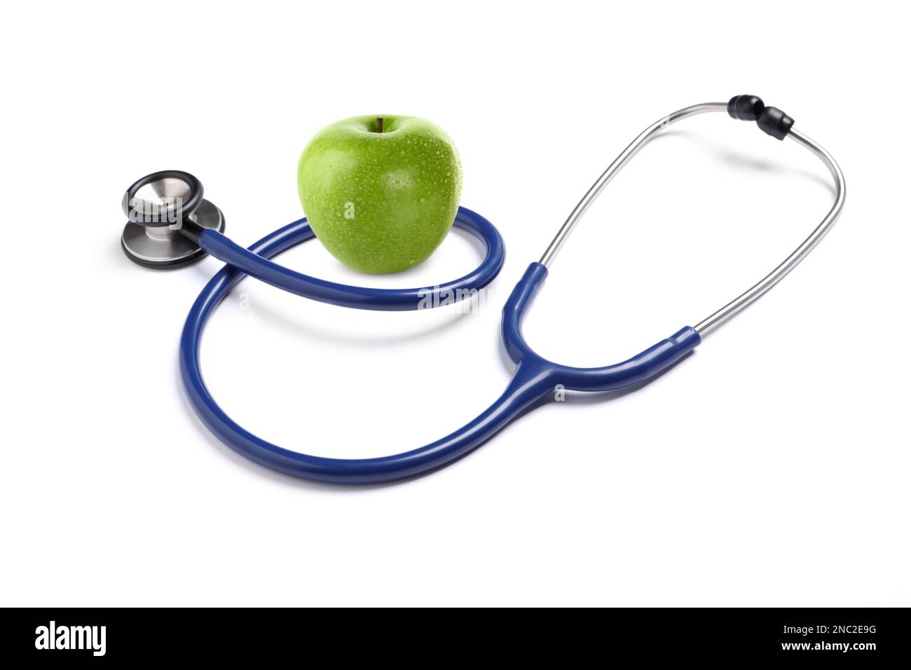 Stethoscope and green apple on white background Stock Photo - Alamy