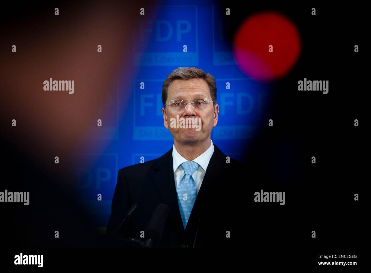 Free Democratric Party (FDP) Chairman and German Foreign Minister Guido Westerwelle addresses the media in Berlin on Monday, March 28, 2011. The Free Democrat's have lost about the half of their votes in the regional state elections in Baden-Wuerttemberg and Rhineland-Palatinate on Sunday.German Chancellor Angela Merkel's conservative party has suffered a defeat in Sunday's state election after almost six decades in powerin Baden-Wuerttemberg . The opposition anti-nuclear Greens could win their first-ever governorship in Baden-Wuerttemberg. (AP Photo/Markus Schreiber) Stock Photo