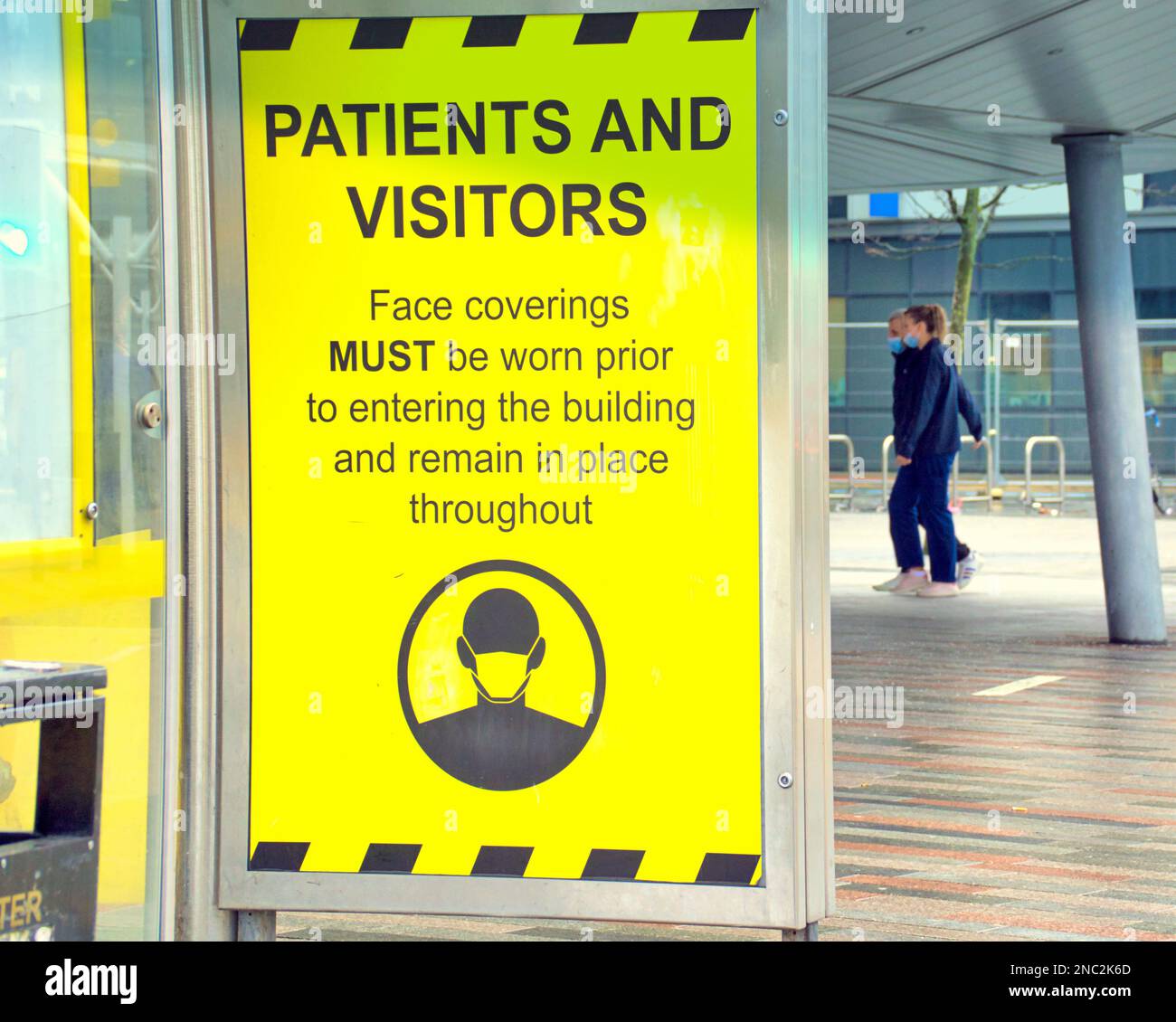 Glasgow, Scotland, UK 14th February, 2023. Facemask advert at queen Elisabeth hospital Govan Government advice for saving energy Advertising hoards gave changed to reflect the difficulty of modern living rather than glamorous aspirational life choices  . Credit Gerard Ferry/Alamy Live News Stock Photo