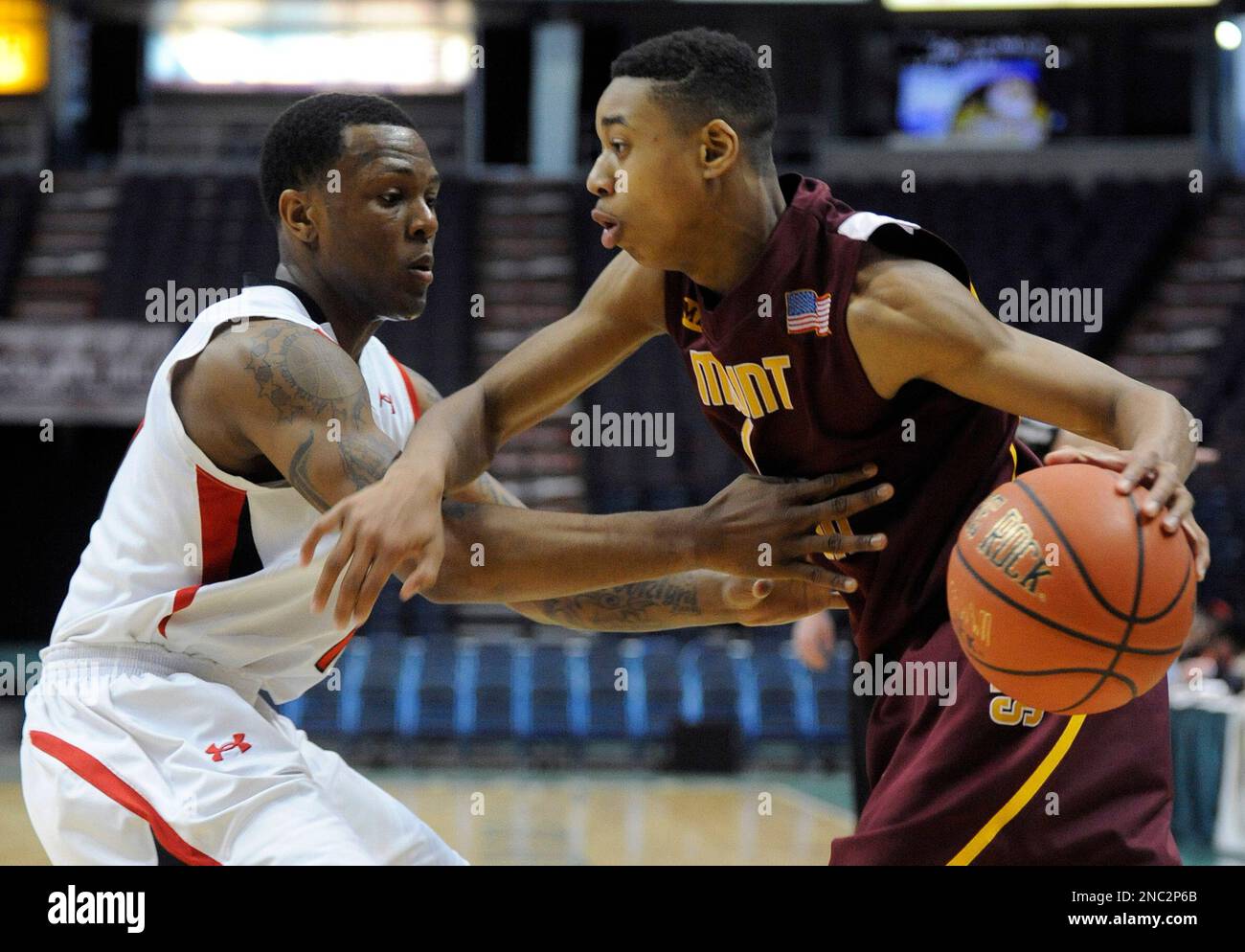 Mount Vernon's Isaiah Cousins, right, is blocked by Boys and Girls