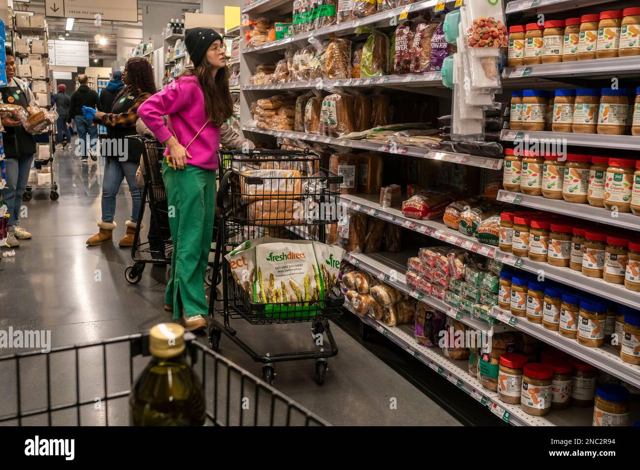 Shopping in a Whole Foods Market supermarket in New York on Thursday, February 9, 2023. Analysts are predicting consumer sentiment will improve to 65.0, up from January’s 64.9, in advance of the release of the report.  (© Richard B. Levine) Stock Photo