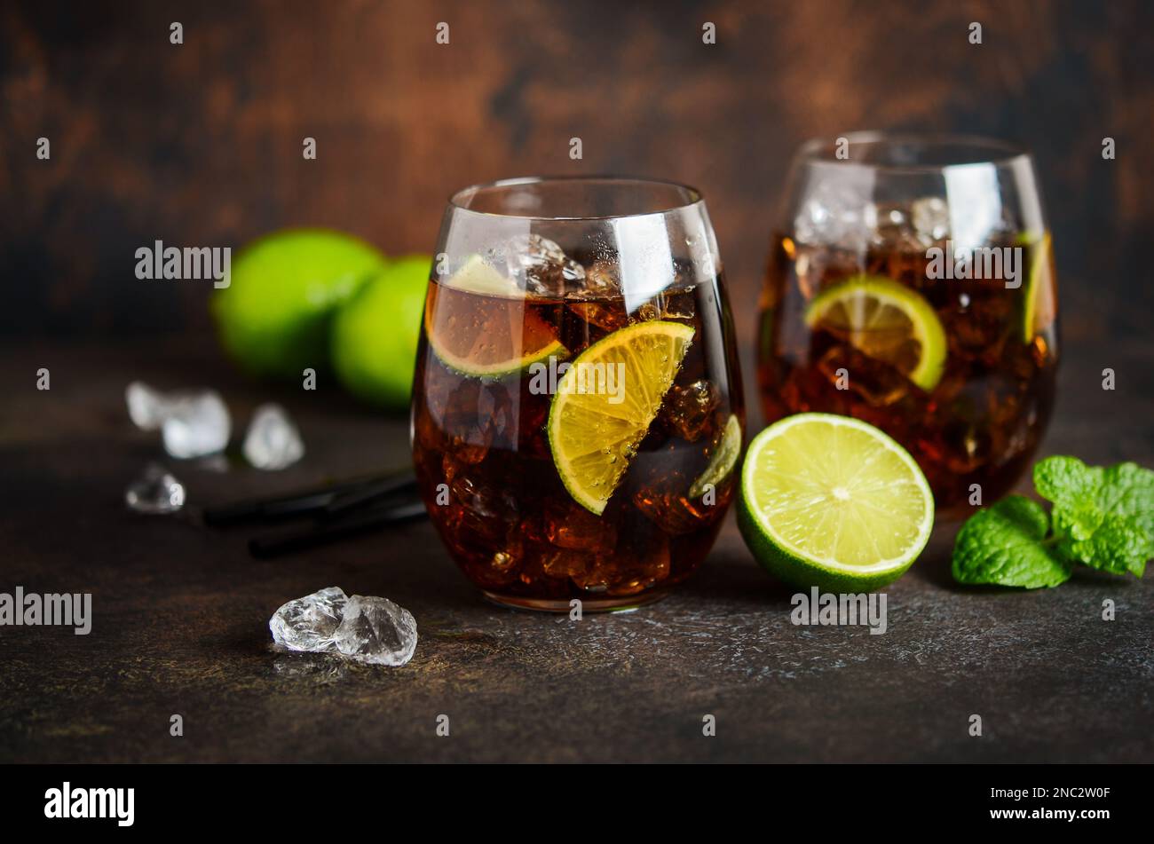Cuba Libre with brown rum, cola and lime. Cuba Libre or long island cocktail. Stock Photo