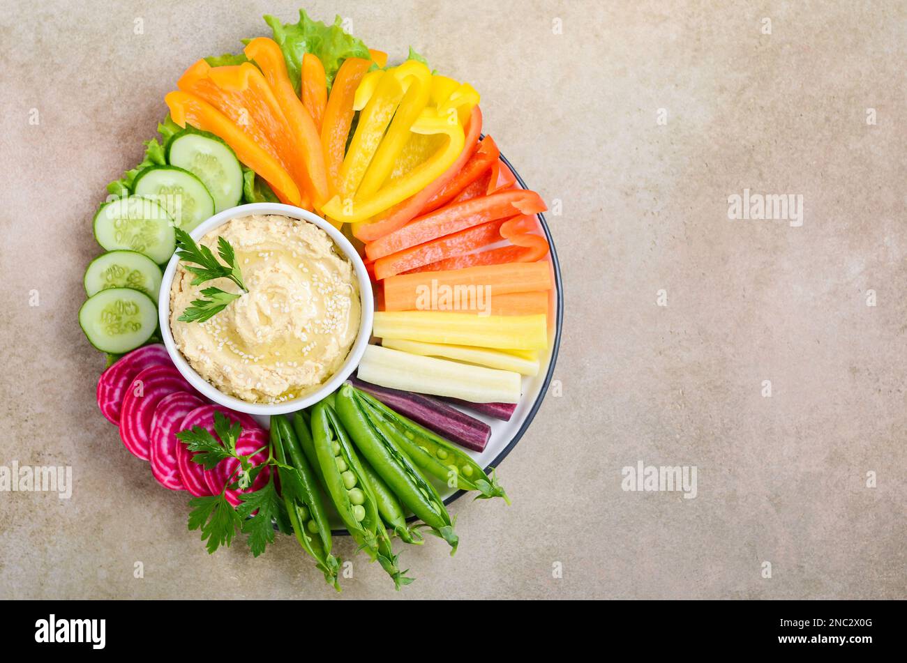 Hummus platter with assorted vegetable snacks. Healthy vegan and