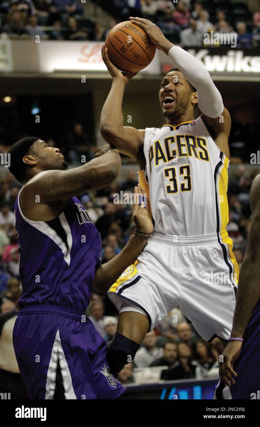 Indiana Pacers forward Danny Granger, right, shoots over Sacramento Kings forward DeMarcus Cousins in the first half an NBA basketball game in Indianapolis, Friday, March 25, 2011. (AP Photo/AJ Mast) Stock Photo