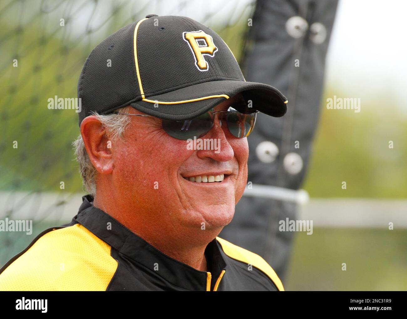 Pittsburgh Pirates manager Clint Hurdle visits behind the batting cage before a spring training