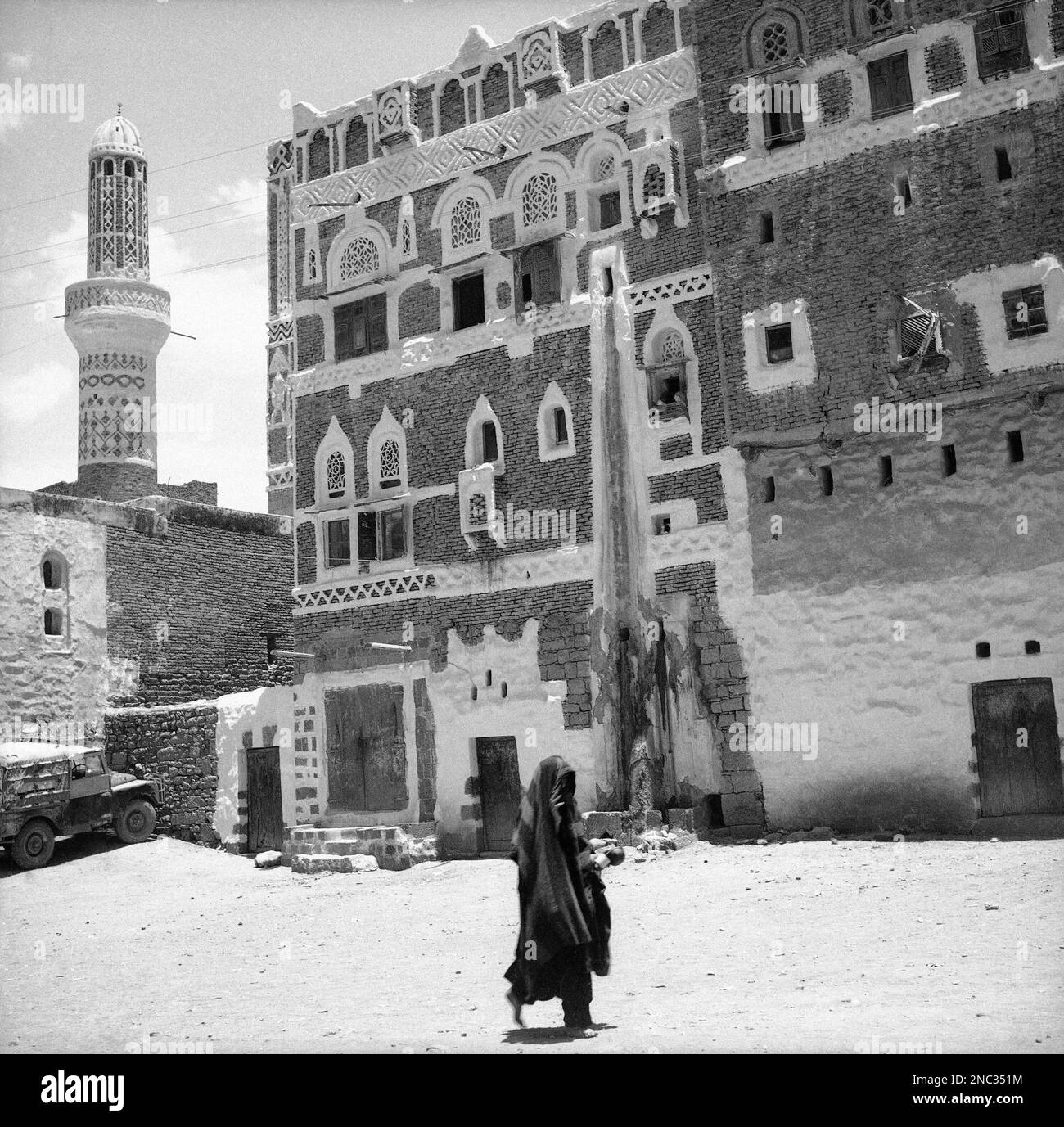 A typical gingerbread house in Sanaa, Yemen on May 26, 1964. A woman