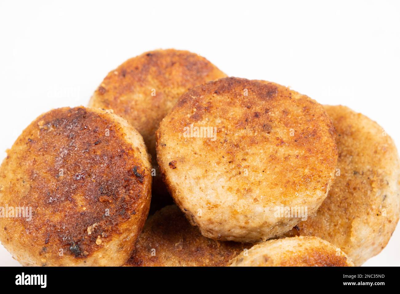 Fried homemade fish cutlets on a white background, close-up, recipe for fish cutlets. Stock Photo