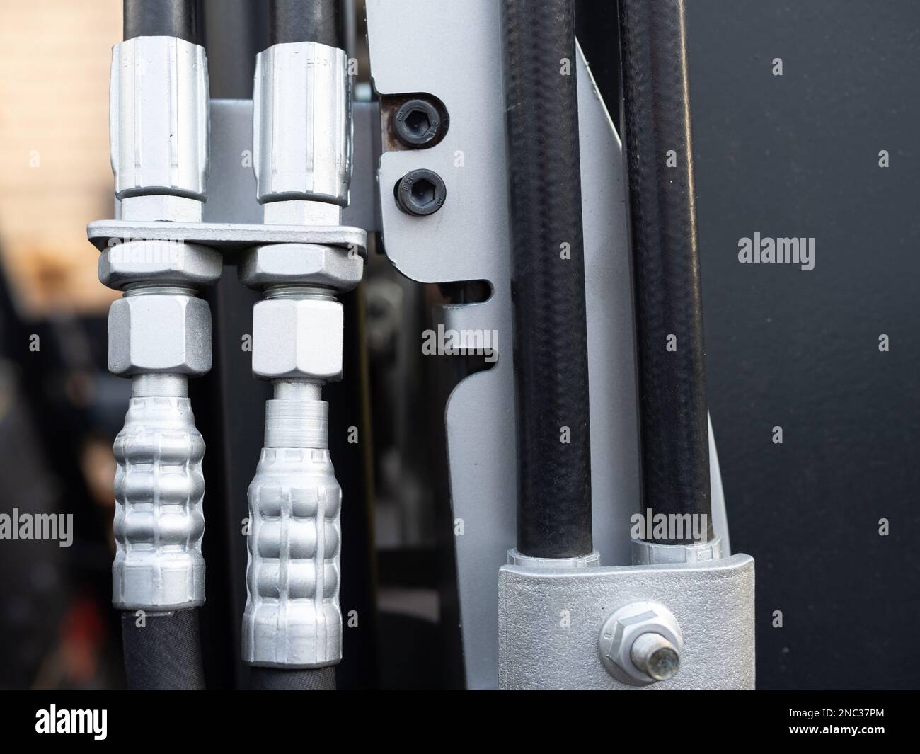 closeup of hydraulic hoses on a fork lift truck and hose connectors Stock Photo