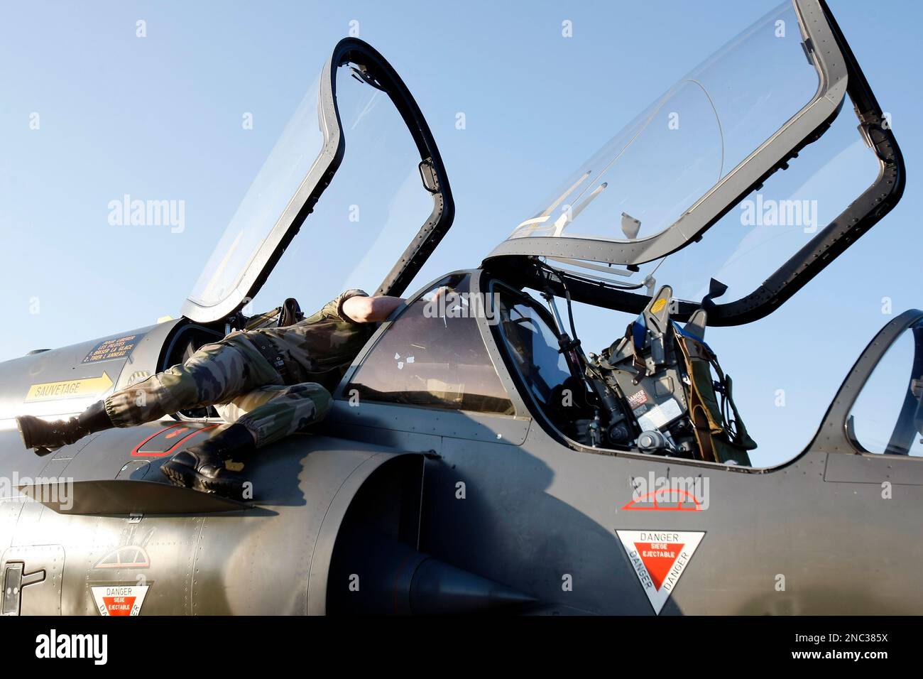 French military ground crew prepare a Mirage 2000 jet fighter for a