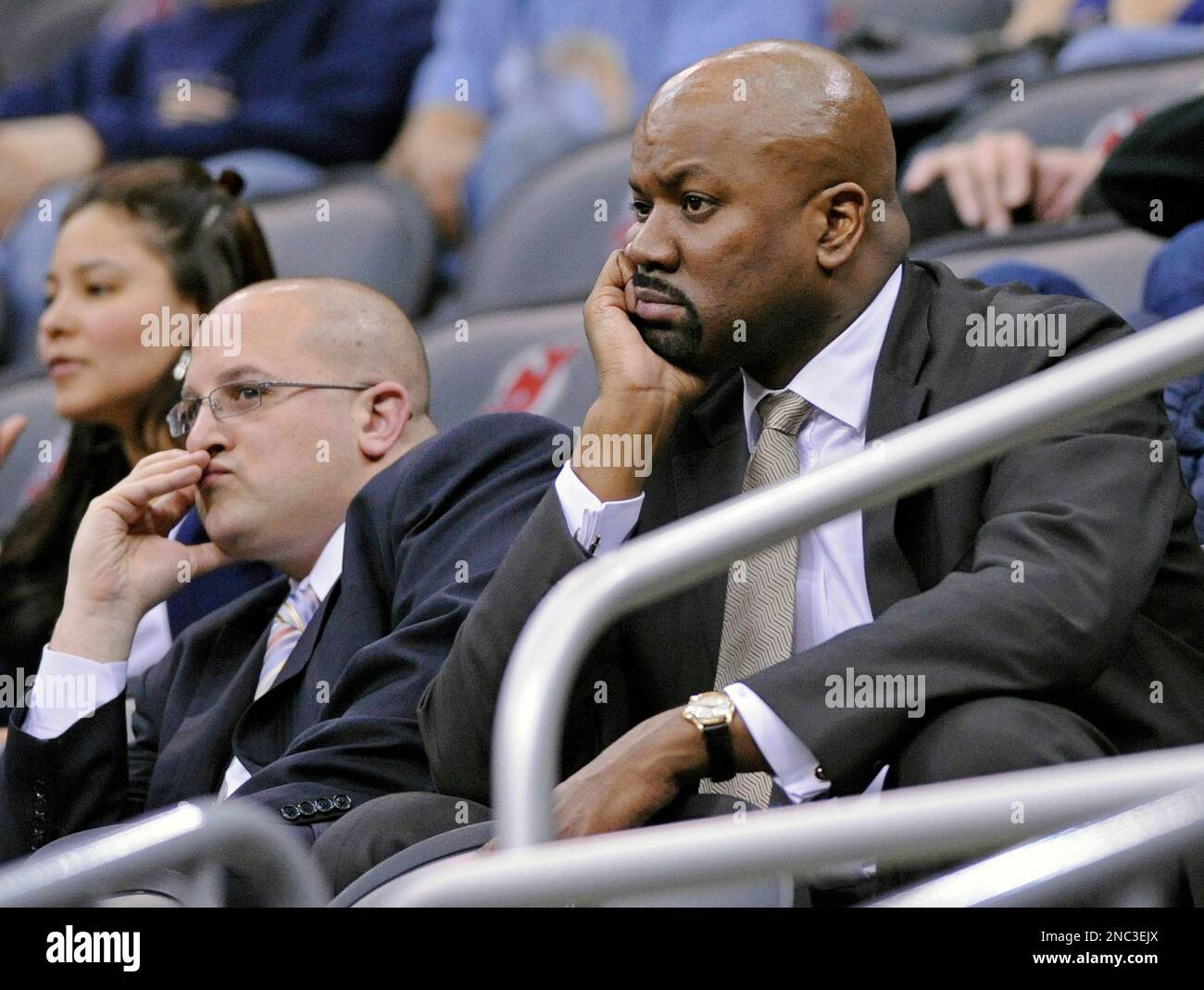 New Jersey Nets General Manager Kiki Vandeweghe (L) watches warm ups as his  son, Ernest Maurice IV, dribbles a basketball before the Nets play the  Denver Nuggets at the Pepsi Center in