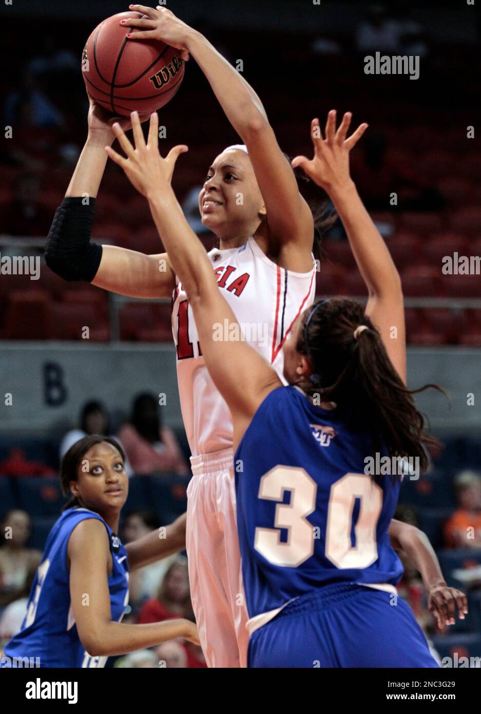 Meredith Mitchell (11) drives around Middle Tennessee State's