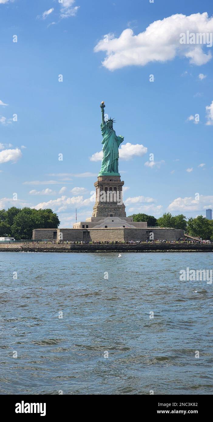A vertical shot of the Statue of Liberty on Liberty Island, New York ...