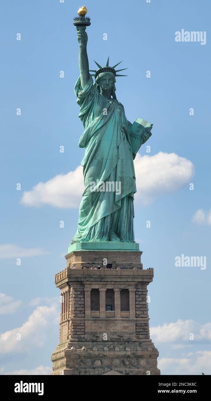 A vertical shot of the Statue of Liberty on Liberty Island, New York ...