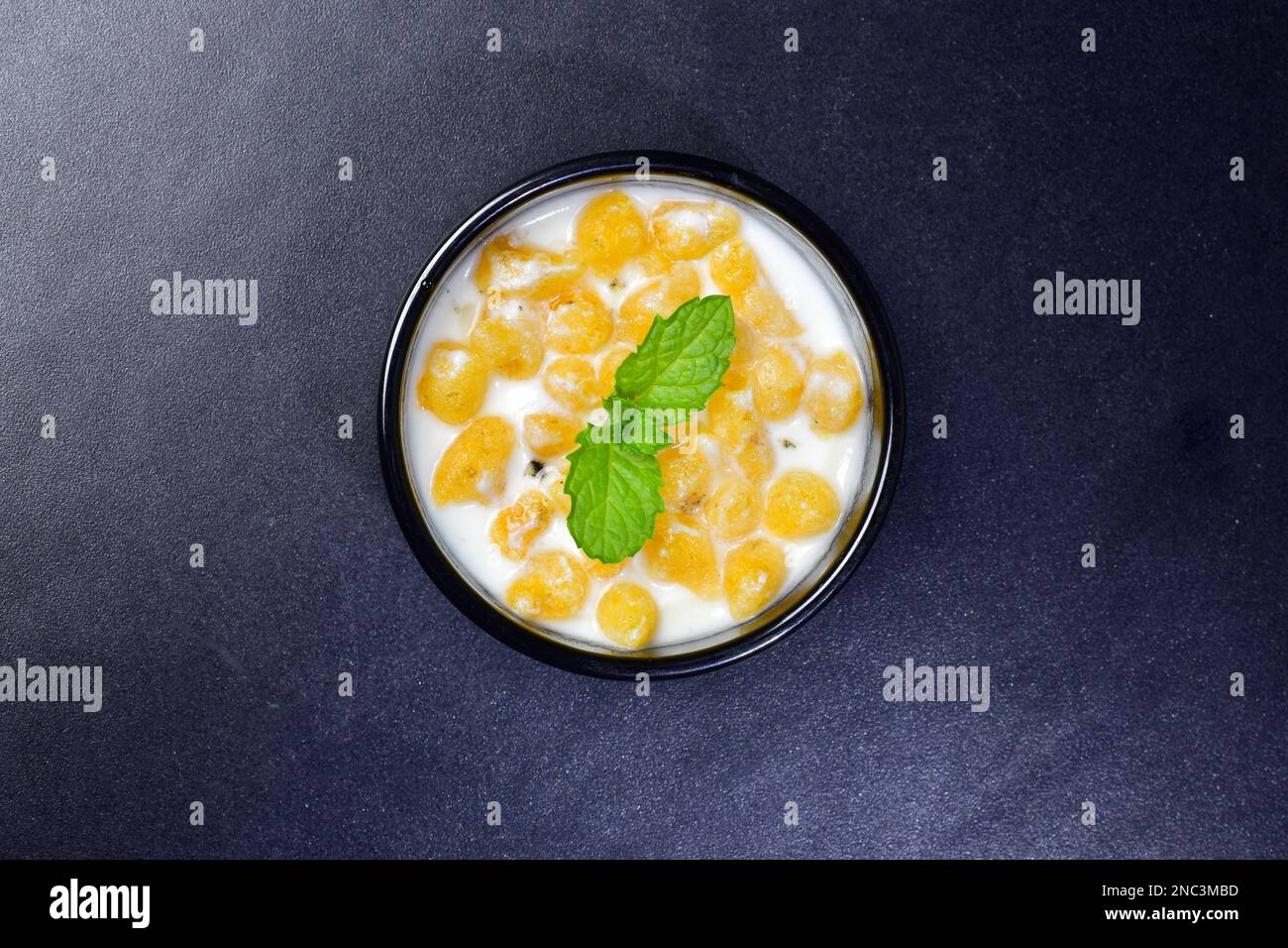 Top view of bundi raita in small serving bowl Stock Photo