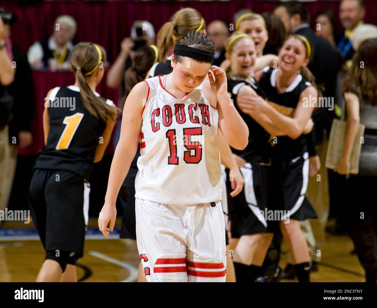 Couch's Sarah Neptune walks off the court as the Purdy team celebrates