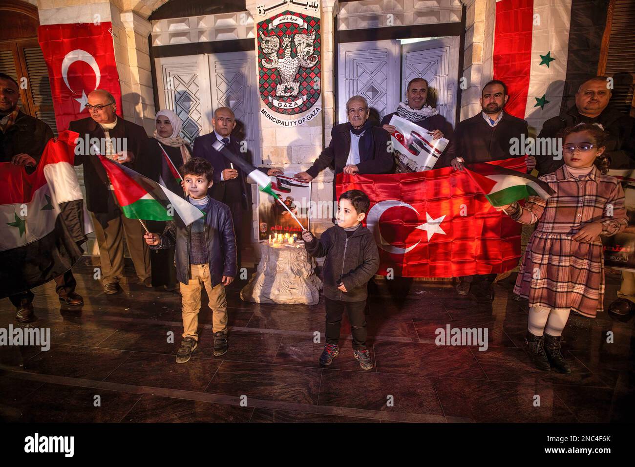Gaza, Palestine. 13th Feb, 2023. Palestinians wave Turkish and Syrian flags in solidarity with the victims of the earthquake that struck Turkey and Syria. (Photo by © Yousef Masoud/SOPA Images/Sipa USA) Credit: Sipa USA/Alamy Live News Stock Photo