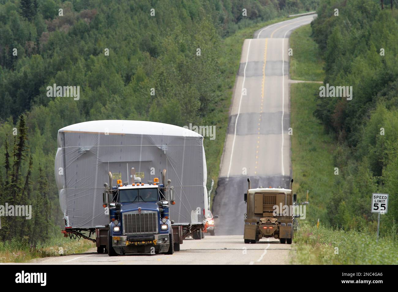 Wide load on the highway in Alaska Stock Photo