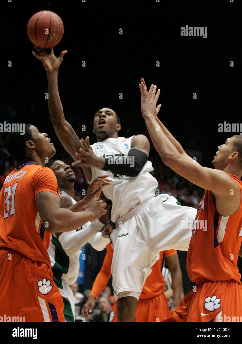 UAB forward Ovie Soko shoots against Clemson's Devin Booker (31) and