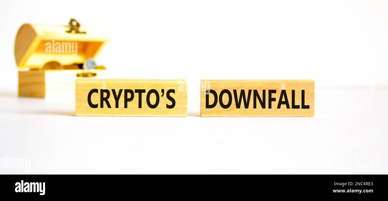 Crypto downfall symbol. Concept words Cryptos downfall on wooden blocks.  Beautiful white table white background. Wooden chest with coins. Business  and Stock Photo - Alamy