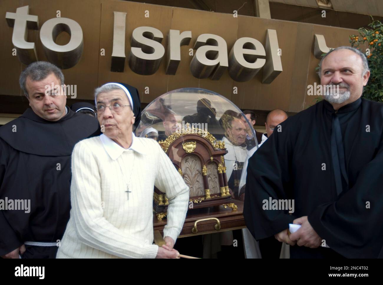 Catholic clergy carry out the relics of St. Therese of Lisieux during a ...