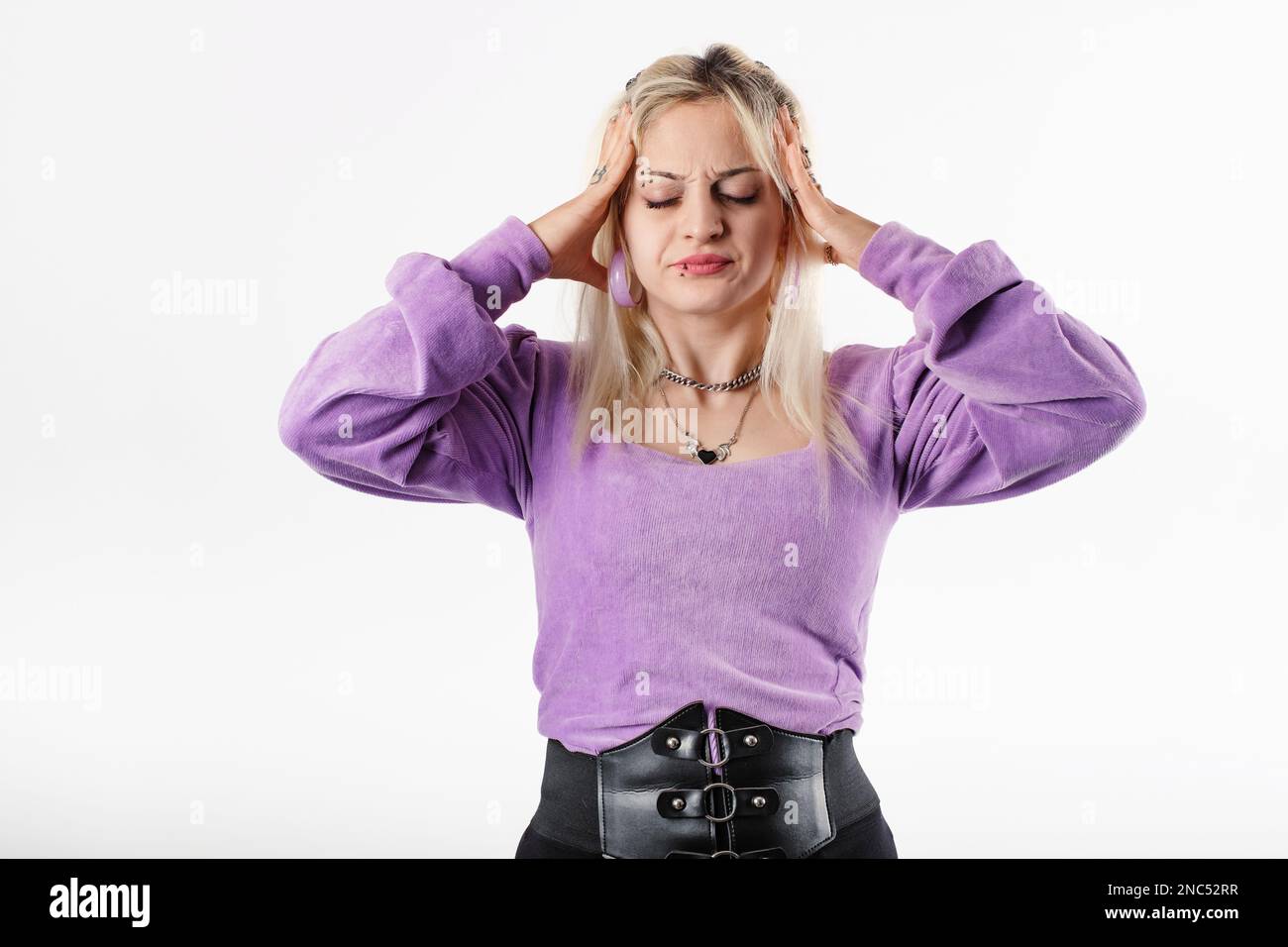 Hands on temples hi-res stock photography and images - Alamy