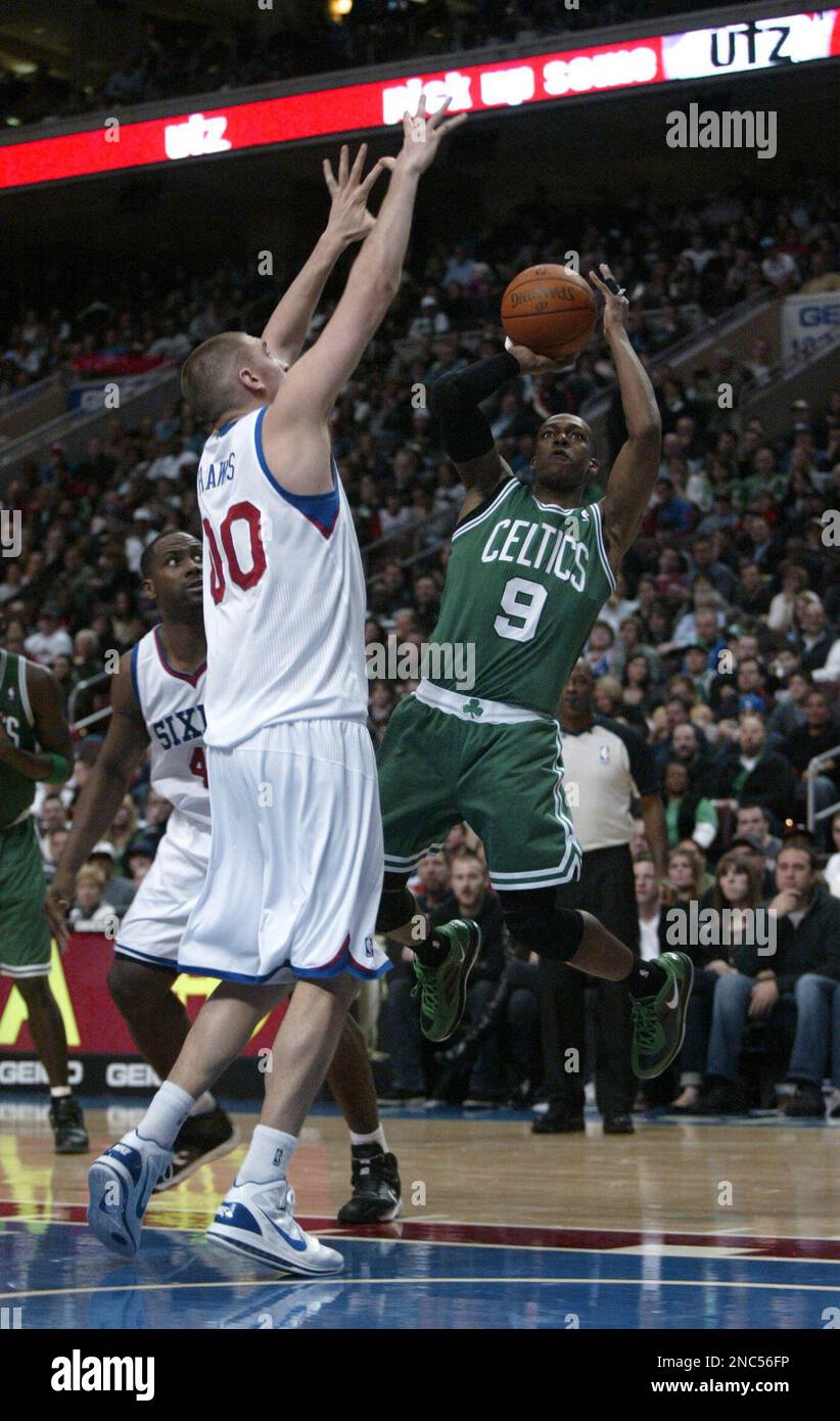 Boston Celtics' Rajon Rondo (9) shoots over Philadelphia 76ers' Spencer ...