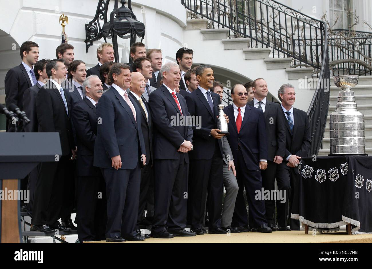 President Barack Obama, center, poses for a group photo during a