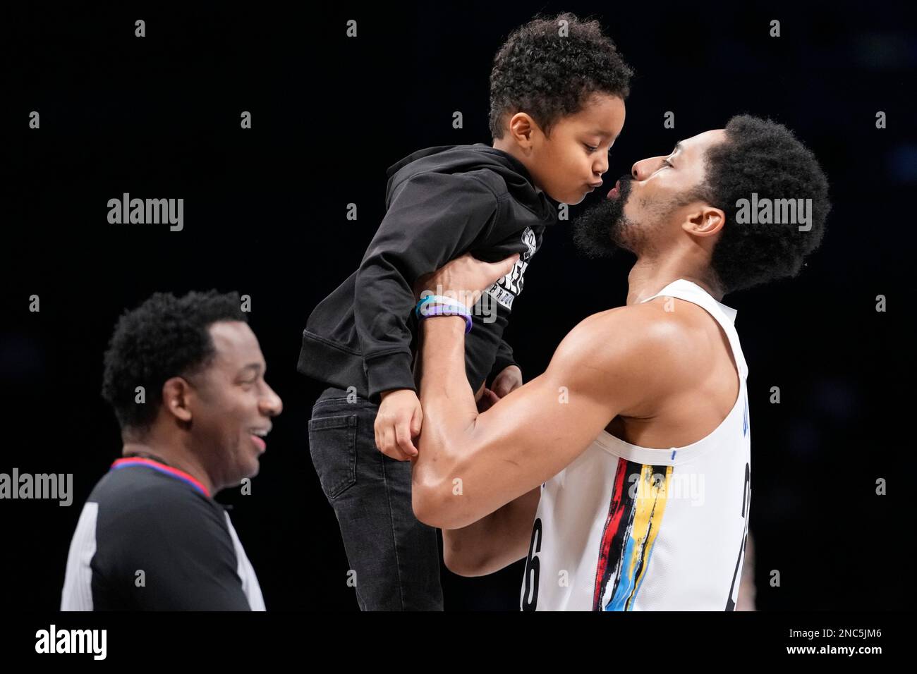 Brooklyn Nets guard Spencer Dinwiddie kisses his son Elijah before the