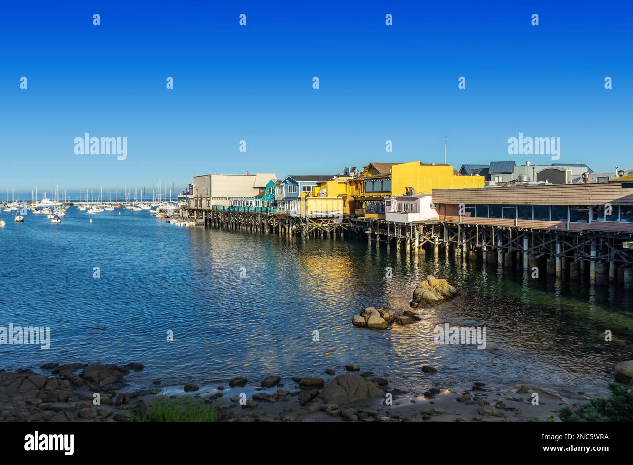 Monterey, CA, USA – December 17, 2022: View from the shore of Fisherman’s Wharf in Monterey, California. Stock Photo