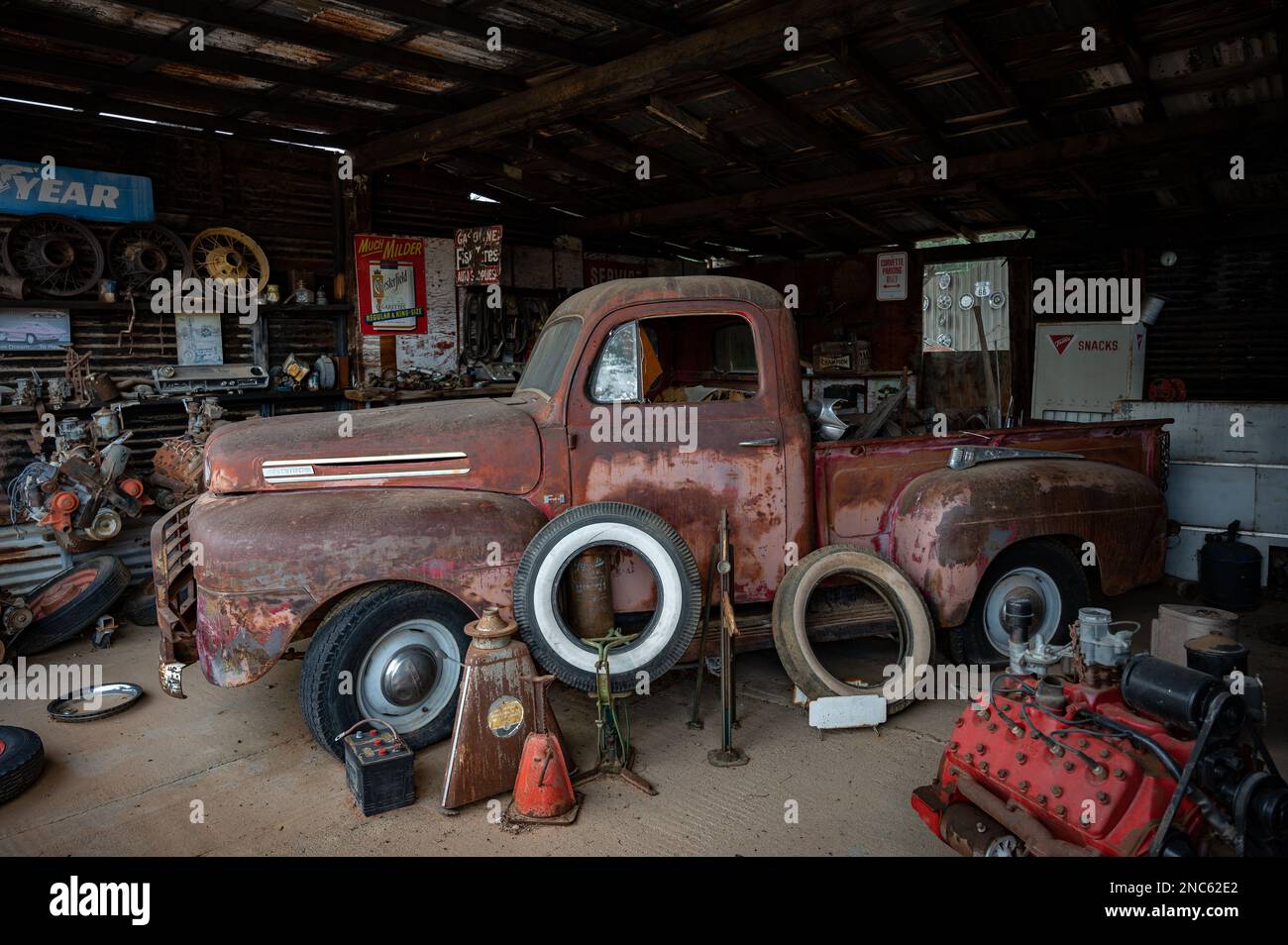 An old abandoned car at mechanic shop on the desert road. Inside is an