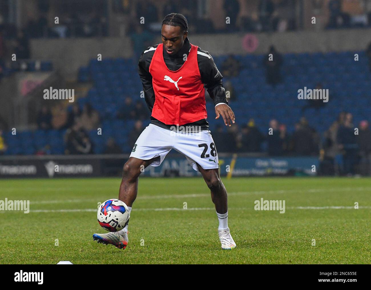 Plymouth Argyle midfielder Jay Matete (28) warming up during the Sky