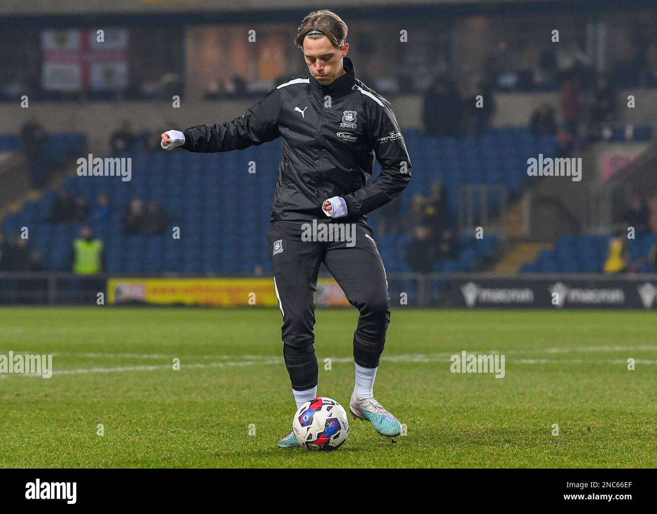 Plymouth Argyle midfielder Callum Wright (26) warming up during the Sky