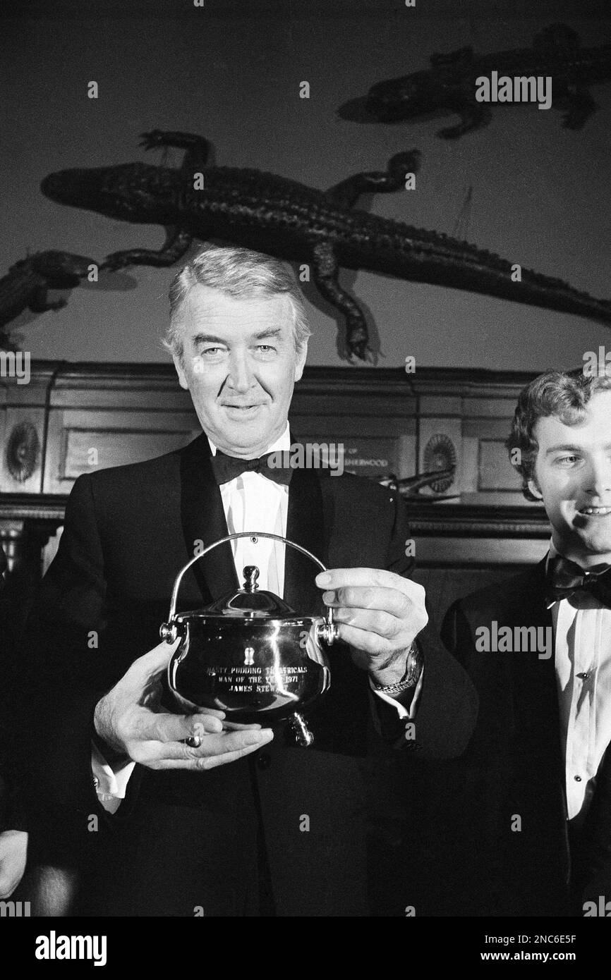 Actor James Stewart holds “Man of the Year” award, a replica of the