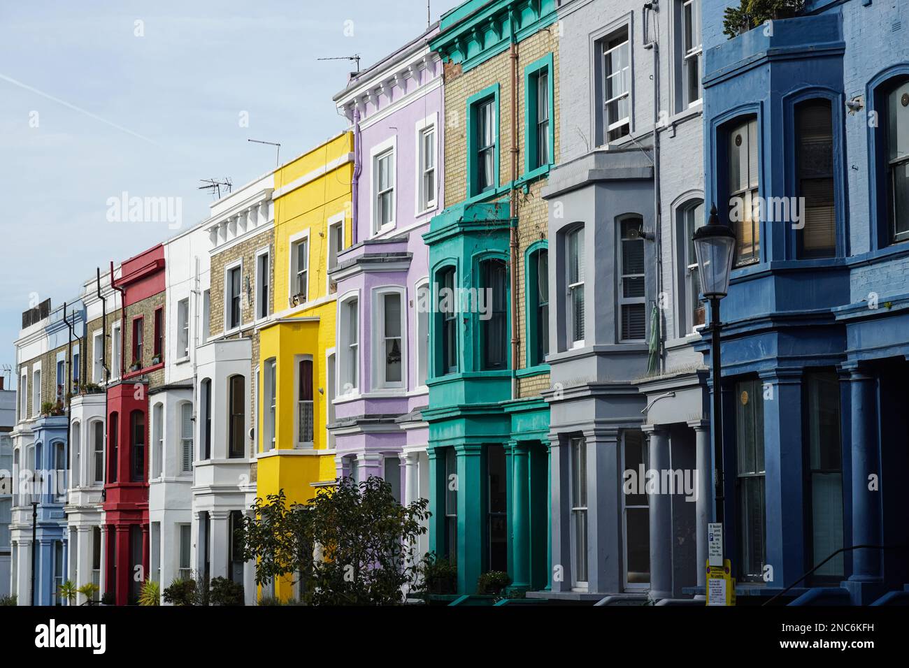 Colorful terrace houses on residential street in Notting Hill, London ...