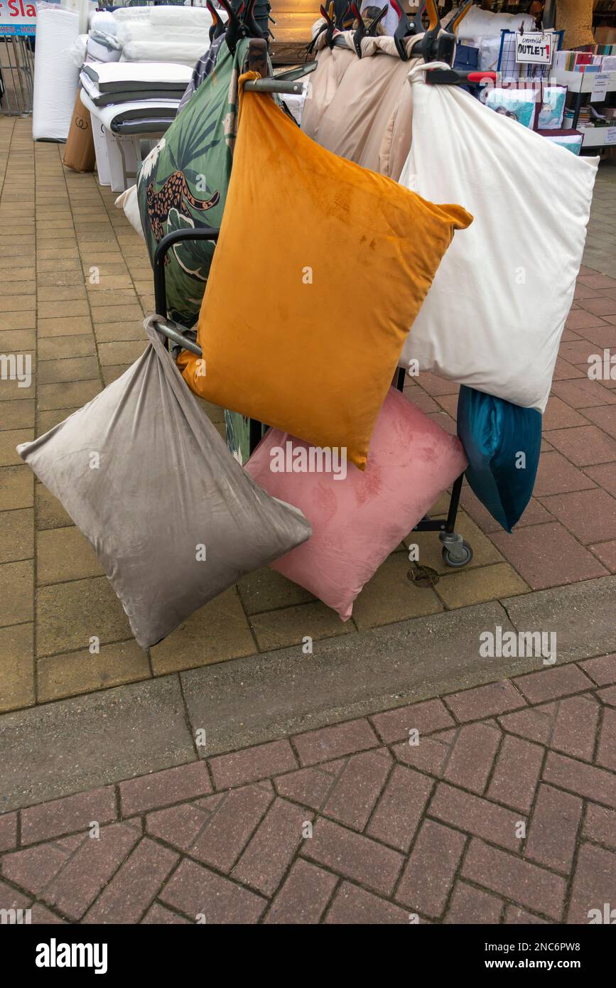 various cushions outside hanging on a rack Stock Photo