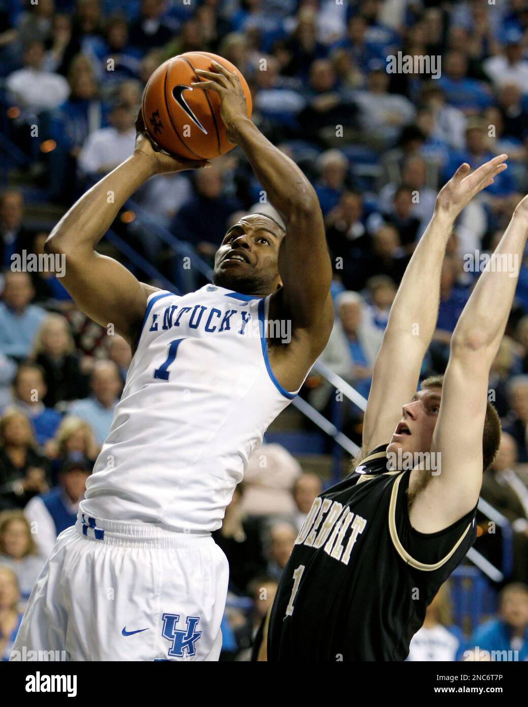 Kentucky's Darius Miller shoots over Vanderbilt's Brad Tinsley during